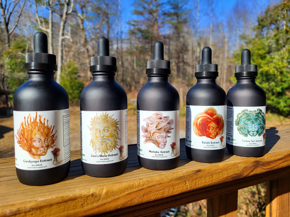 A lineup of Mindfull Mycology ultrasonic-assisted functional mushrooms extracts atop a wooden railing at Mindfull Mycology headquarters.